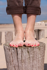 Standing on a beach pole