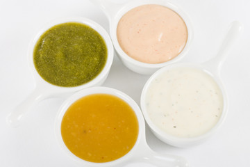 Dips - Rose sauce, mint raita, coriander sauce and mango chutney