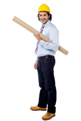 Young architect holding blueprint