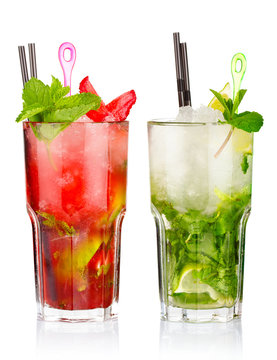 Two mojito cocktails with strawberry and lime fruits isolated