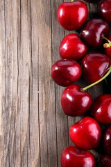 Ripe of cherry on a wooden table 