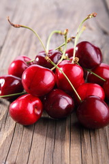 Ripe of cherry on a wooden table 