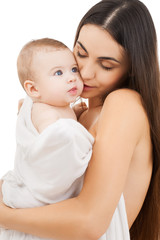 Obraz na płótnie Canvas mother kissing adorable baby