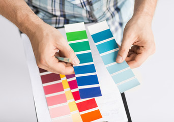 man with color samples for selection
