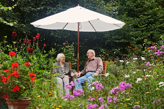 aged couple on the garden bench