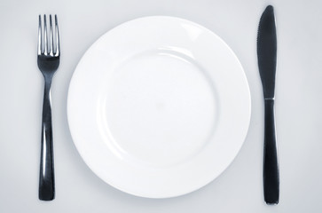 Empty plate and utensils