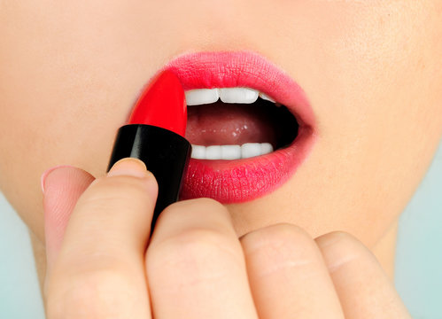 Woman Applying Lipstick