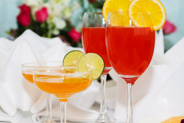 exotic cocktails and flowers on table