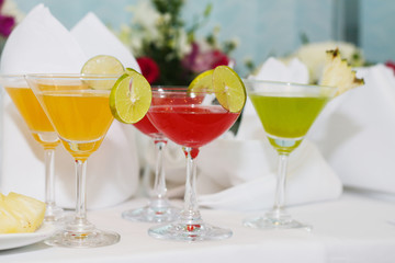 exotic cocktails and flowers on table