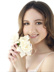 Obraz na płótnie Canvas Sexy young woman holding gardenia flower