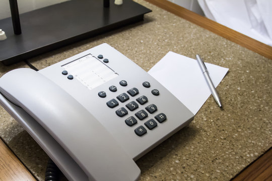 Telephone in Hotel Room with Note Paper