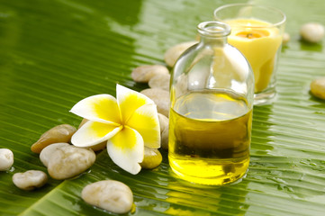 White plumeria and therapy stones and banana leaf texture