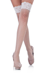 Woman legs with stockings on white