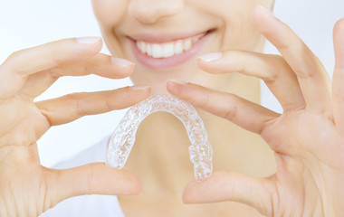 smiling girl with tooth tray