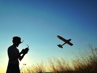 Fototapeta na wymiar man playing with rc airplane