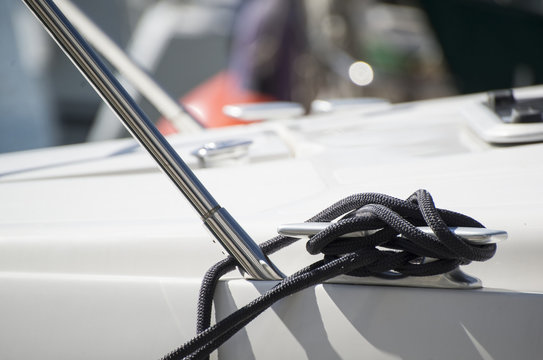 Fototapeta Detail image of yacht rope cleat on sailboat deck