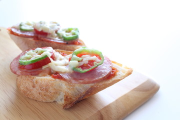 peppr and salami on bread for pizza toast image