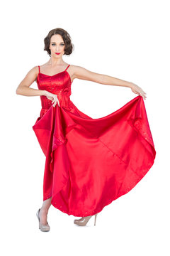 Gorgeous flamenco dancer posing holding her dress