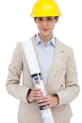Architect posing with hard hat and plan