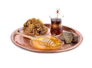 honey on plate ,cup of Turkish tea,propolis