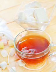 Fresh tea with candy