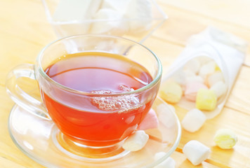 Fresh tea with candy