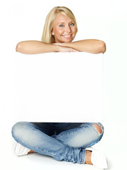 Blonde woman with white message board