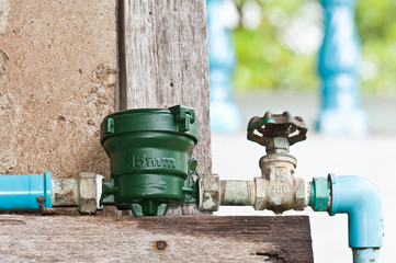 Fototapeta na wymiar new water meter with rust metal valve