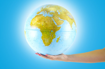 Earth globus in hand, various background