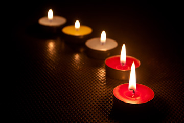 candle and flame in dark .