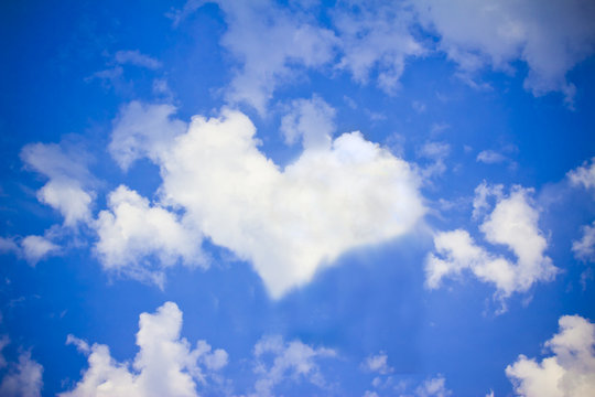 bright blue sky with heart cloud