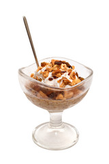 Dessert with peanuts, raisins and cream isolated