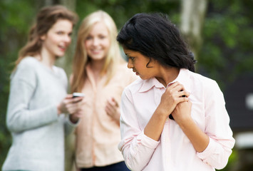 Teenage Girl Being Bullied By Text Message On Mobile Phone