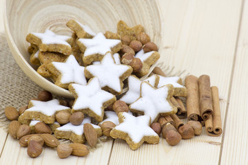 typical christmas cinnamon star cookies, nuts and cinnamon stick