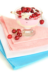 Delicious cherry dessert in glass vase isolated on white