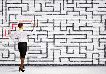 Businesswoman solving maze problem