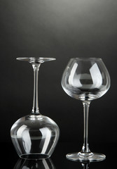 Empty wine glasses on grey background