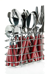 Kitchen cutlery, knives, forks and spoons in metal stand,