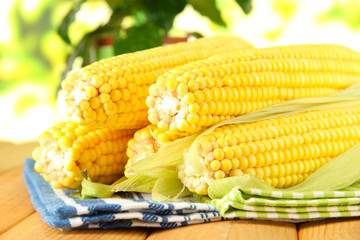 Crude corns on napkin on wooden table on window background