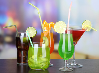 Set of different drinks on bright background