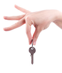 Silver key in a hand.  Hand holding key