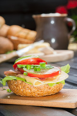 Healthy sandwich with cucumber, lettuce and tomato