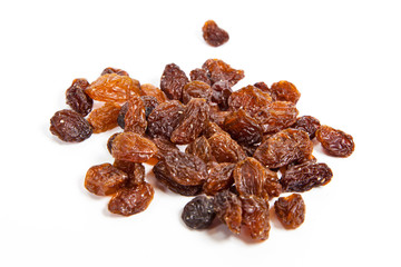 brown raisins on a white background