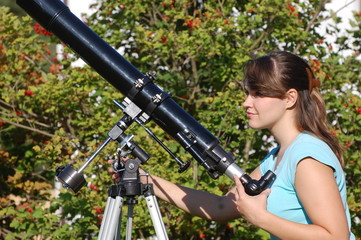 Teen girl and telescope.   Near Kiev,Ukraine