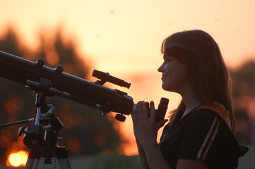 Fototapeta premium Teen girl and telescope. Near Kiev,Ukraine