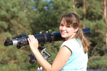 Teen girl and telescope.  Near Kiev,Ukraine
