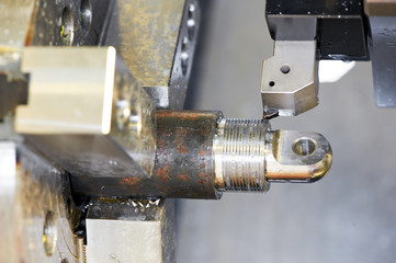 Close-up process of metal machining by threading