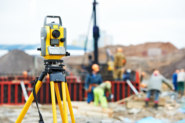 surveyor equipment theodolite at construction site - obrazy, fototapety, plakaty