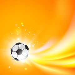 Obraz premium Shining soccer-ball on an orange background