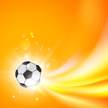 Shining soccer-ball on an orange background